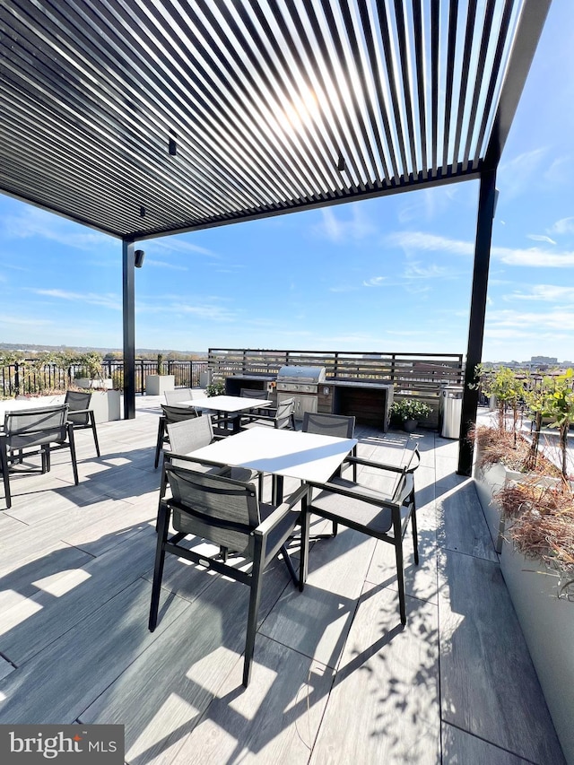 view of patio / terrace featuring a grill, outdoor dining space, and a pergola