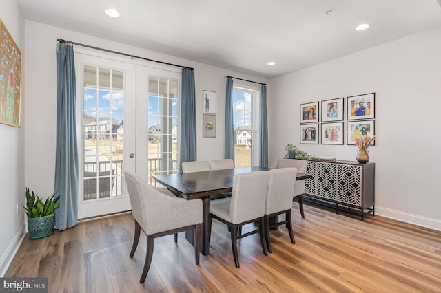 dining room with recessed lighting, french doors, light wood-type flooring, and baseboards