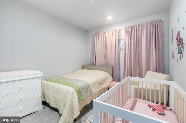 carpeted bedroom featuring recessed lighting