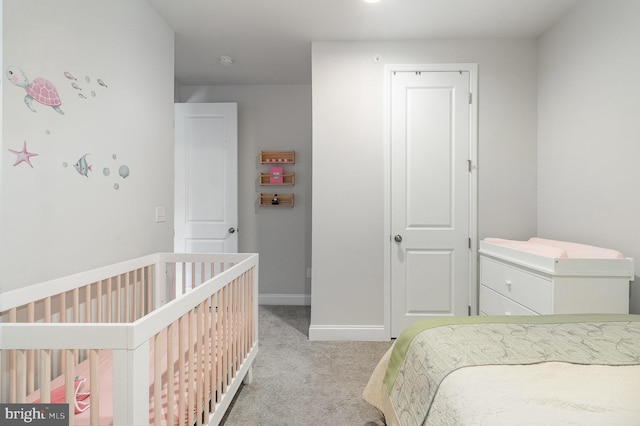 bedroom with baseboards and carpet floors