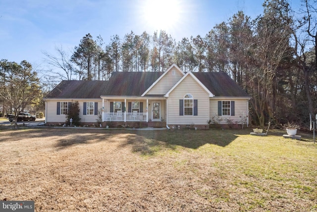 ranch-style house featuring crawl space, covered porch, and a front lawn