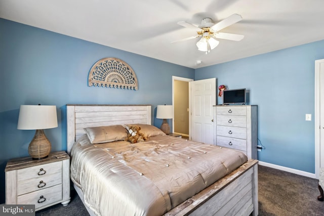 bedroom with baseboards, dark colored carpet, and ceiling fan