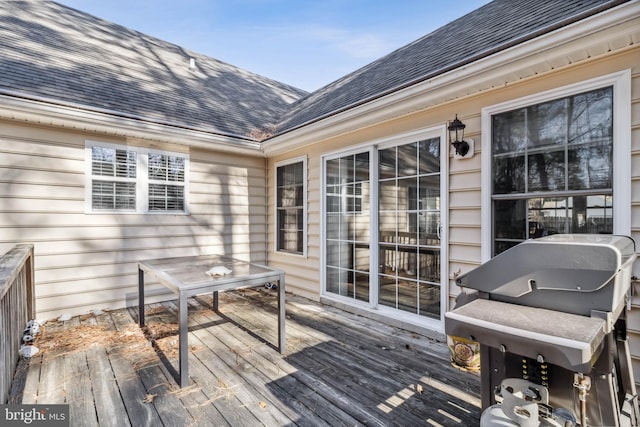 wooden terrace with area for grilling