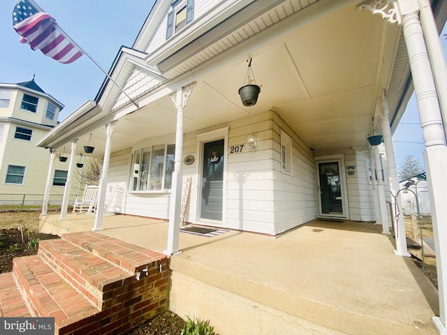 view of patio featuring a porch