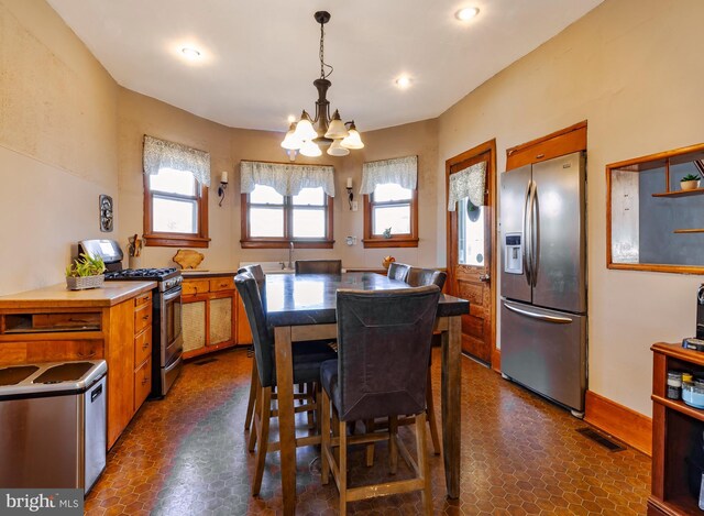 dining space with recessed lighting, visible vents, baseboards, and a notable chandelier