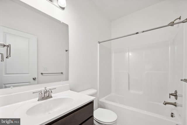 bathroom with vanity, shower / bathing tub combination, and toilet