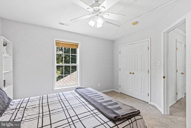 bedroom featuring carpet, visible vents, baseboards, attic access, and a closet