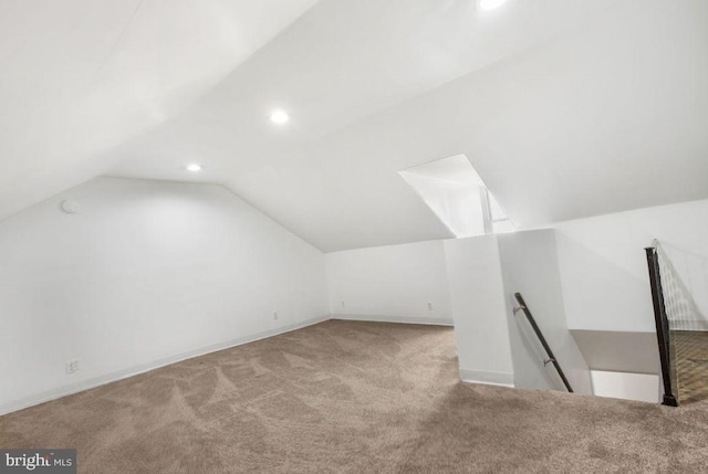 additional living space with vaulted ceiling, recessed lighting, and carpet floors