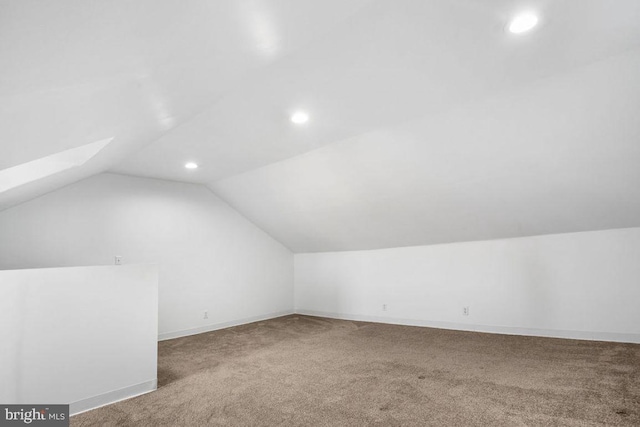 bonus room with carpet flooring, recessed lighting, baseboards, and lofted ceiling