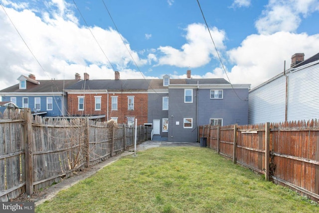 view of yard with a fenced backyard