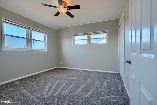 unfurnished bedroom featuring carpet flooring, ceiling fan, and baseboards