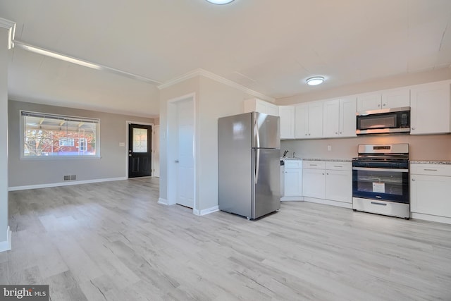 kitchen with white cabinets, light wood-style flooring, visible vents, and appliances with stainless steel finishes