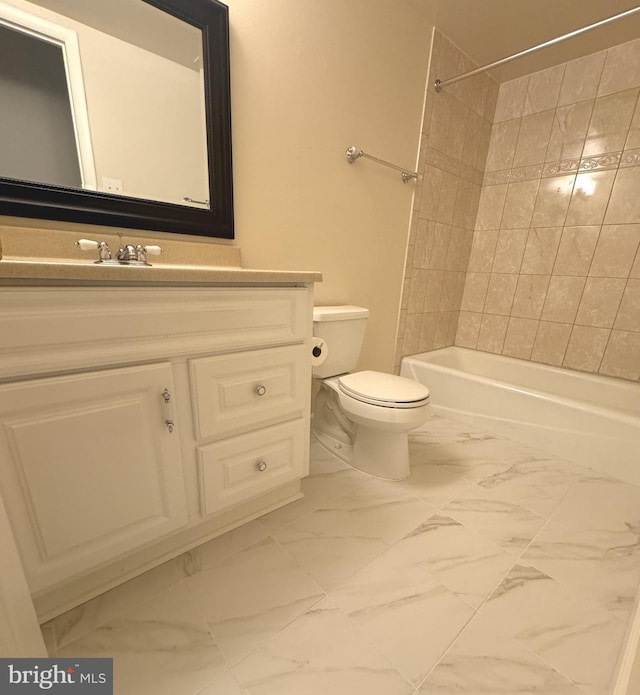 full bathroom with toilet, marble finish floor, shower / washtub combination, and vanity