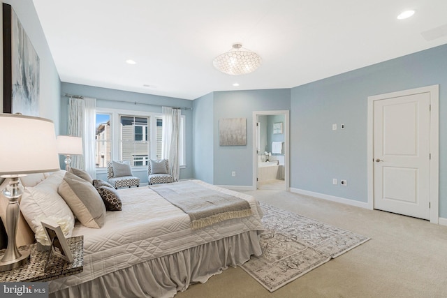 bedroom featuring recessed lighting, light colored carpet, connected bathroom, and baseboards