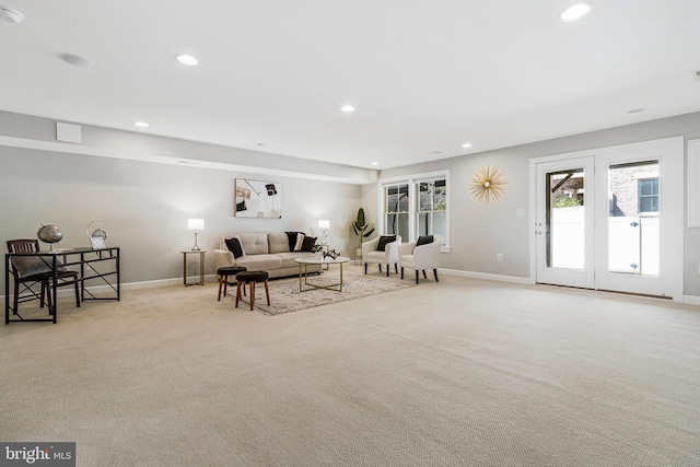 living room with recessed lighting, baseboards, and carpet floors