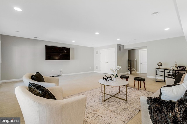 living area with recessed lighting, stairway, baseboards, and visible vents