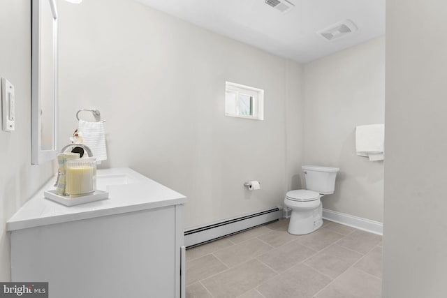 bathroom with visible vents, toilet, a baseboard heating unit, baseboards, and vanity