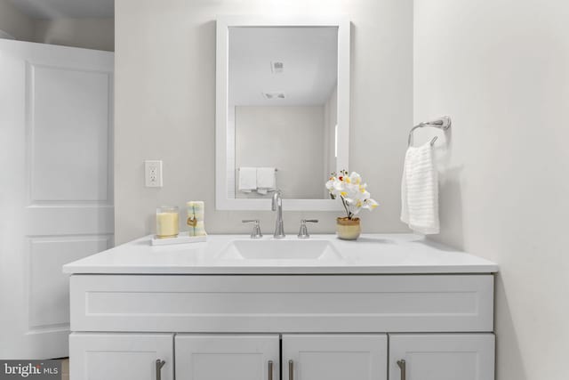 bathroom with visible vents and vanity