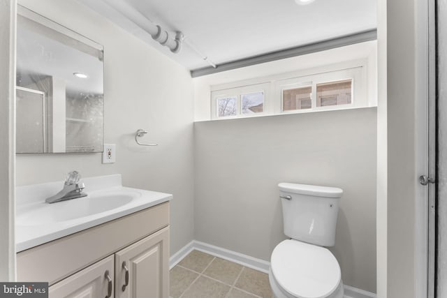 full bath featuring baseboards, toilet, tile patterned floors, an enclosed shower, and vanity