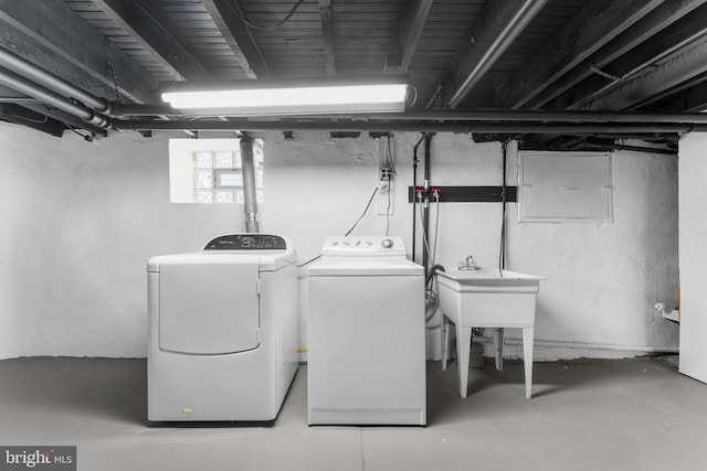 laundry room with washing machine and clothes dryer and laundry area