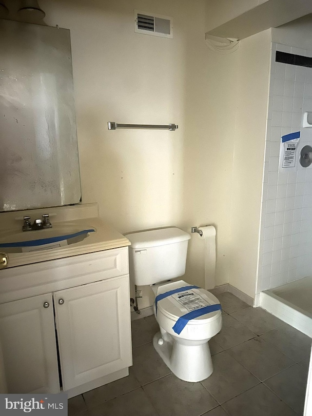 full bath featuring visible vents, a shower stall, toilet, tile patterned floors, and vanity