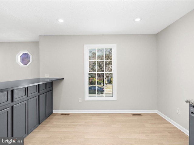 dining area featuring plenty of natural light, visible vents, and light wood finished floors