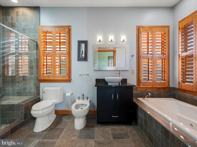 bathroom featuring a shower stall, baseboards, toilet, a bidet, and a garden tub