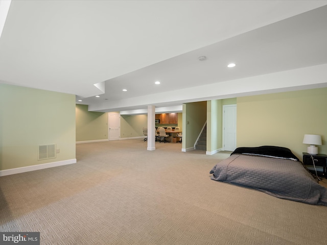 bedroom with light carpet, visible vents, recessed lighting, and baseboards