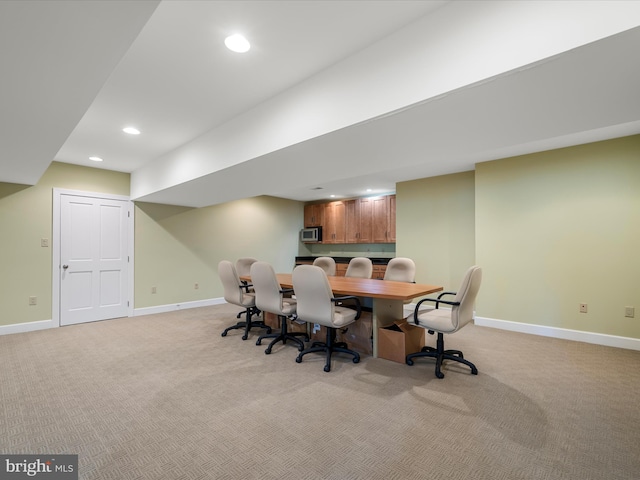 interior space with recessed lighting, baseboards, and light carpet