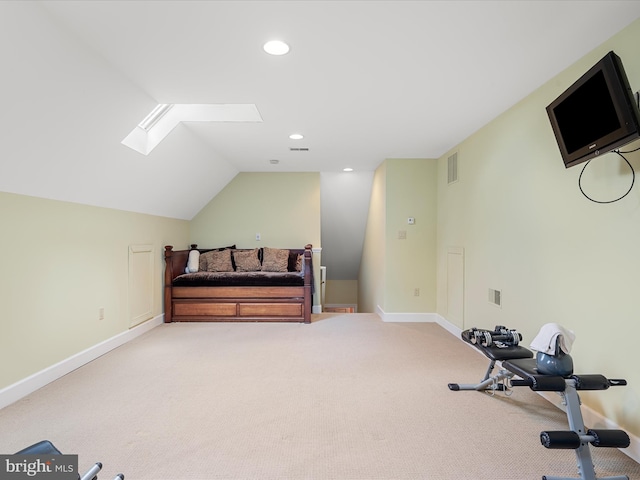 workout area featuring recessed lighting, visible vents, vaulted ceiling with skylight, and baseboards