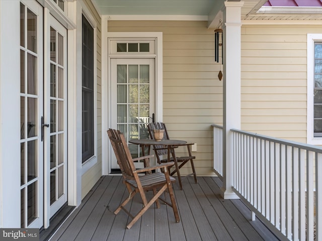 wooden terrace with french doors and covered porch