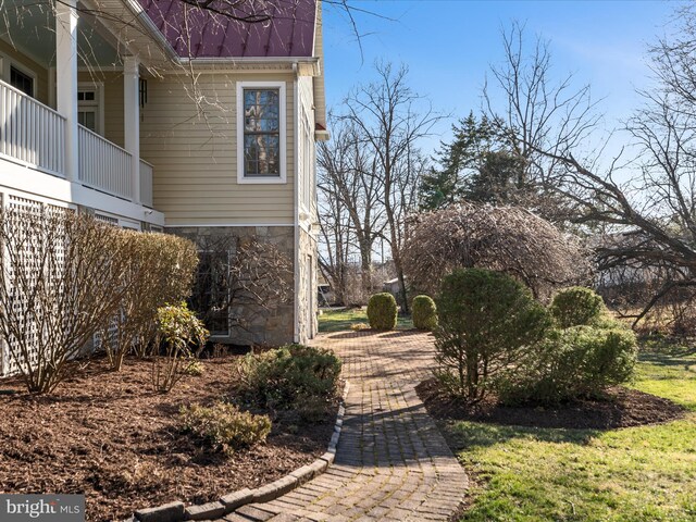 view of property exterior featuring stone siding