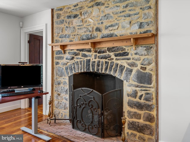 details with wood finished floors and a fireplace