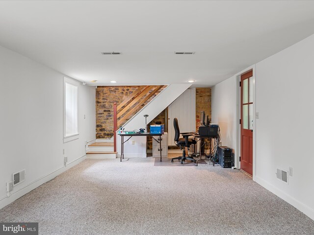 carpeted home office with visible vents and baseboards