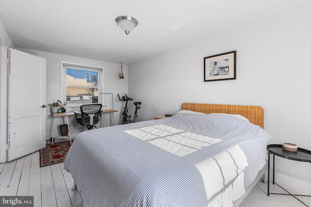 bedroom featuring wood finished floors