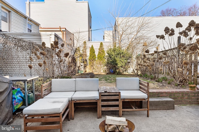 view of patio / terrace with an outdoor hangout area and fence