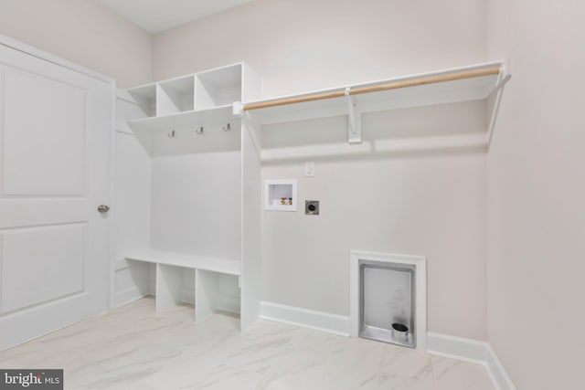 washroom featuring washer hookup, laundry area, marble finish floor, and hookup for an electric dryer