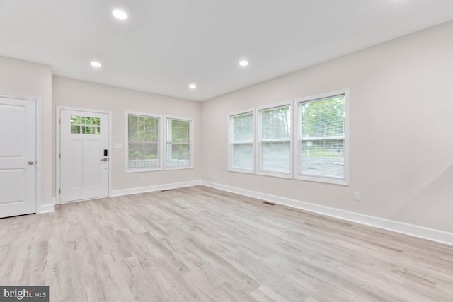 unfurnished living room with visible vents, light wood-style flooring, recessed lighting, and baseboards