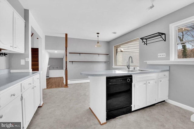 kitchen with a sink, white cabinetry, light countertops, a baseboard radiator, and dishwasher