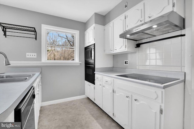 kitchen with baseboards, a sink, black appliances, white cabinets, and under cabinet range hood