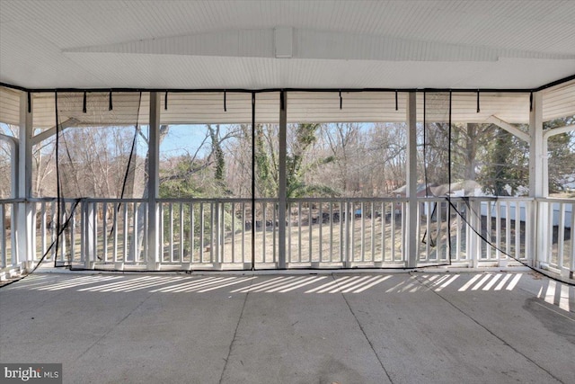 unfurnished sunroom featuring plenty of natural light