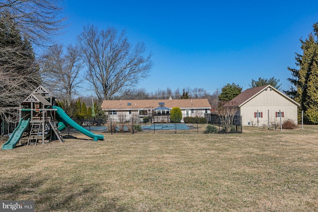 exterior space featuring a lawn and fence