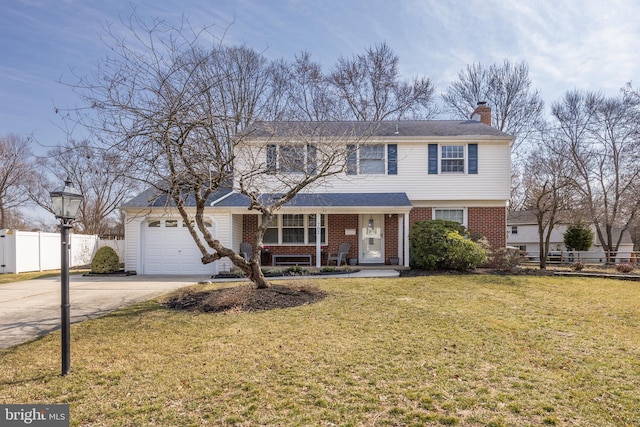 view of front of property with a front lawn, driveway, fence, an attached garage, and brick siding