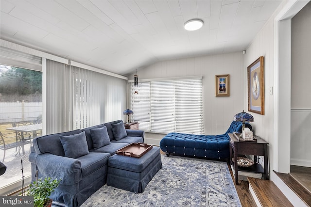 living area featuring wood finished floors and vaulted ceiling