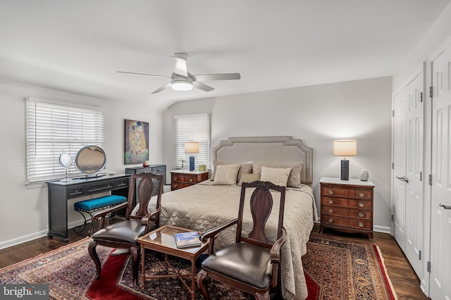 bedroom featuring wood finished floors, baseboards, and ceiling fan