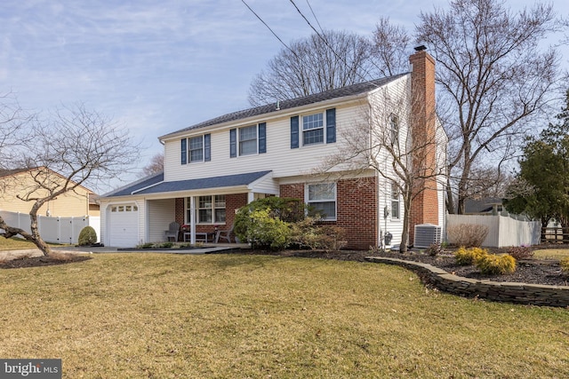 view of front of house featuring fence, a front yard, an attached garage, brick siding, and a chimney