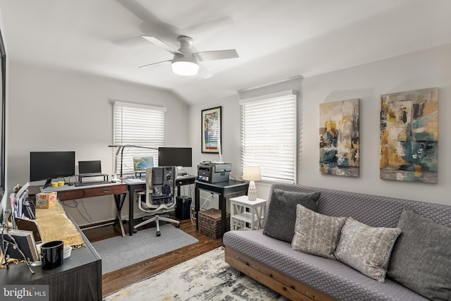 home office featuring plenty of natural light, lofted ceiling, wood finished floors, and a ceiling fan