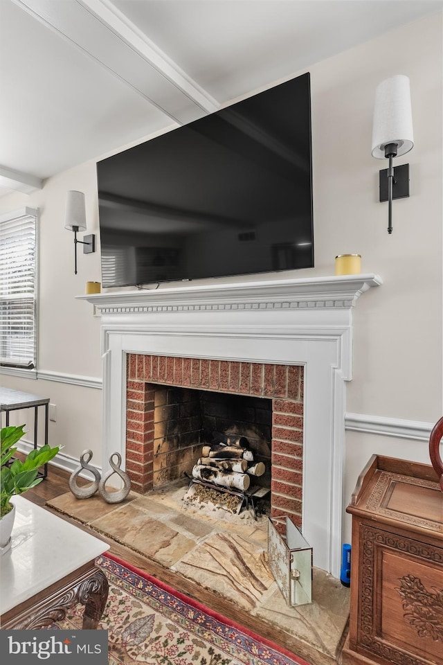 interior details featuring a brick fireplace