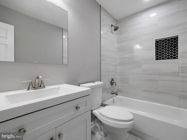 bathroom featuring shower / bath combination, toilet, and vanity