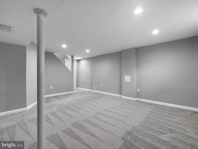 finished below grade area with visible vents, recessed lighting, carpet, and baseboards